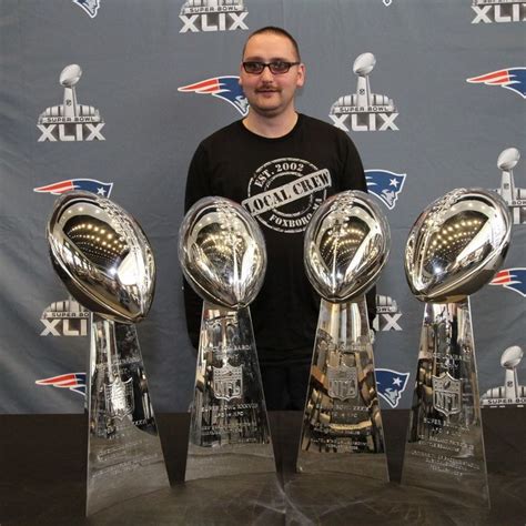 My friend Mike, with the Patriot's 4 recent Superbowl Victor's Trophies ...