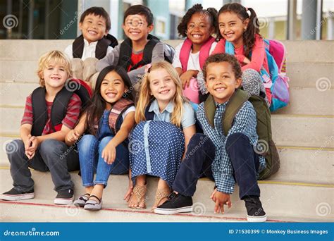 A Group of Elementary School Kids Sitting on School Steps Stock Image - Image of american, asian ...