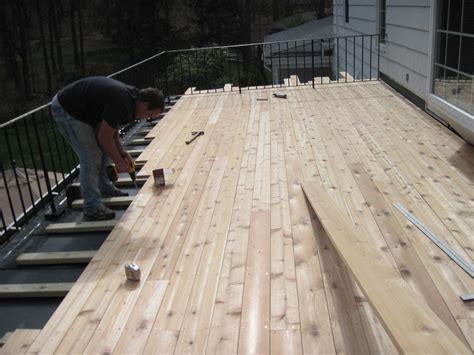 Building a rooftop deck | Epdm flat roof, Building a deck, Flat roof