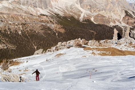 Premium Photo | Skier in dolomites snow