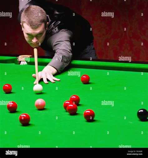 Snooker player taking a shot Stock Photo - Alamy