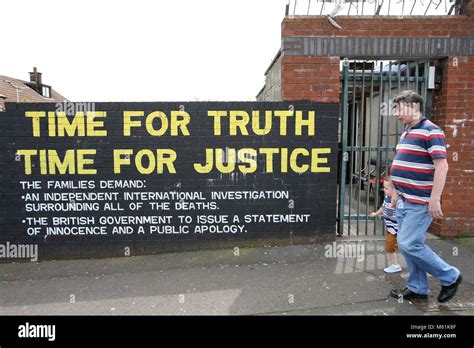 Murals dedicated to the 1971 Ballymurphy Massacre seen on a wall in ...