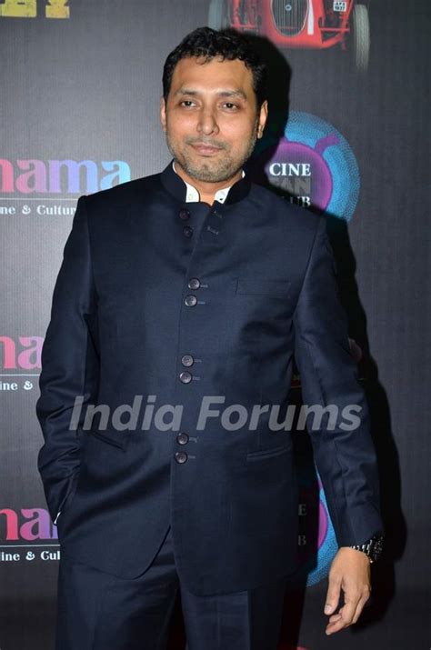 Neeraj Pandey poses for the media at the Red Carpet Premier of Baby Media