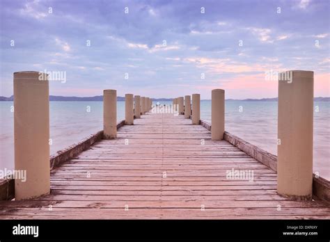 Wooden Jetty at Dusk, Maraetai, Auckland Region, North Island, New Zealand Stock Photo - Alamy