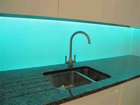 Illuminated colour changing glass splash back installed to apartment in Chelsea. Costal Bathroom ...