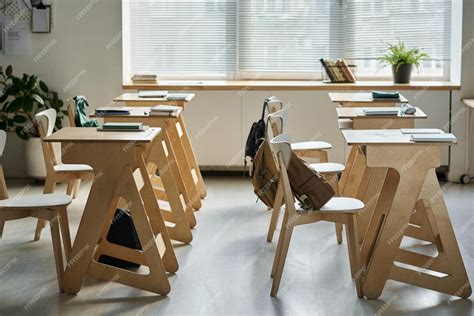 Premium Photo | Empty classroom with desks for students