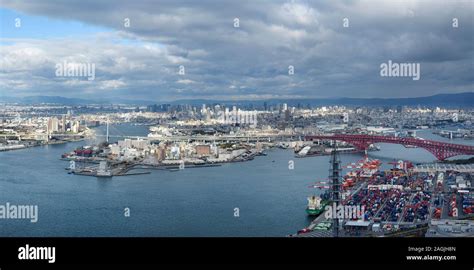 Osaka city skyline panoramic scenery of Osaka Bay, Tempozan and Minato bridges and a port ...