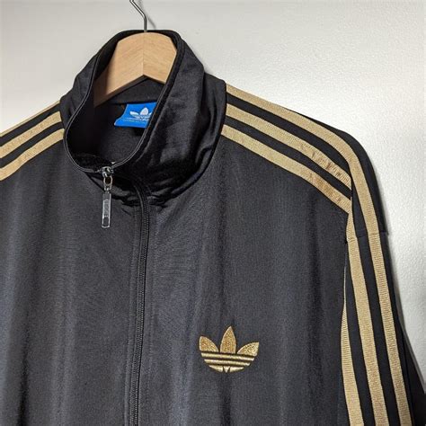 Adidas Originals Men's Black and Gold Jacket | Depop