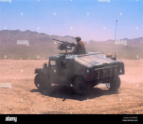 US Marine Turret Gunner on a Humvee Roams the Desert Stock Photo - Alamy