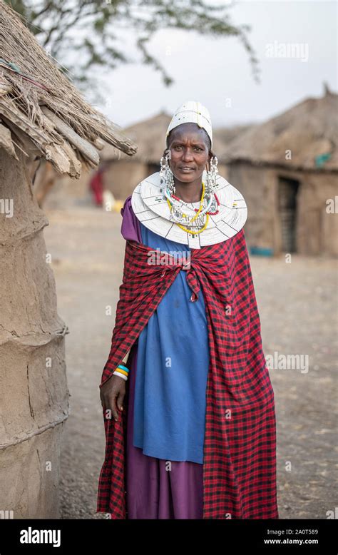 Arusha, Tanzania, 7th September 2019: beautiful maasai women in traditional clothing, wearing ...