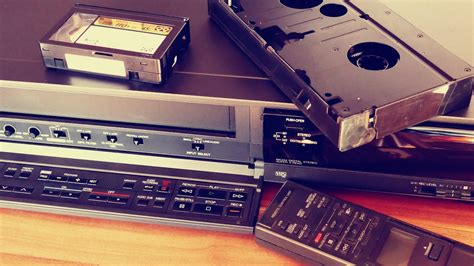 Black Vhs on Vhs Player Beside Remote Control · Free Stock Photo