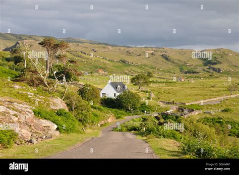 Narrow street in a sparsely populated coastal landscape on the coast of ...