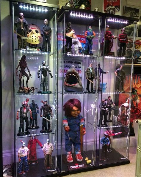 a display case filled with action figures and toys