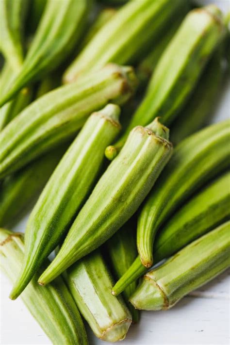 Fresh okra pods that will be used to make easy low-carb roasted okra ...