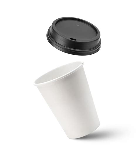 Premium Photo | White paper coffee cup and black lid in the air