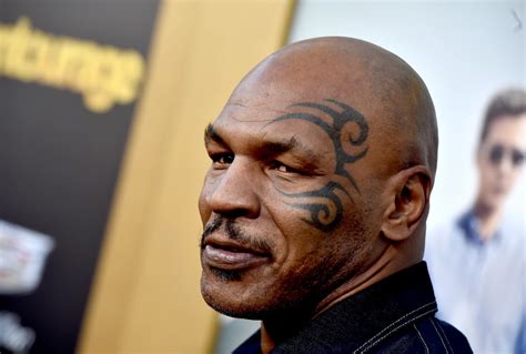 Mike Tyson Throwing Darts Blindfolded [Video]