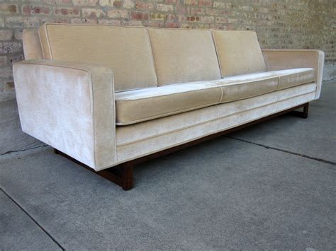 circa midcentury: 'danish modern' velour sofa