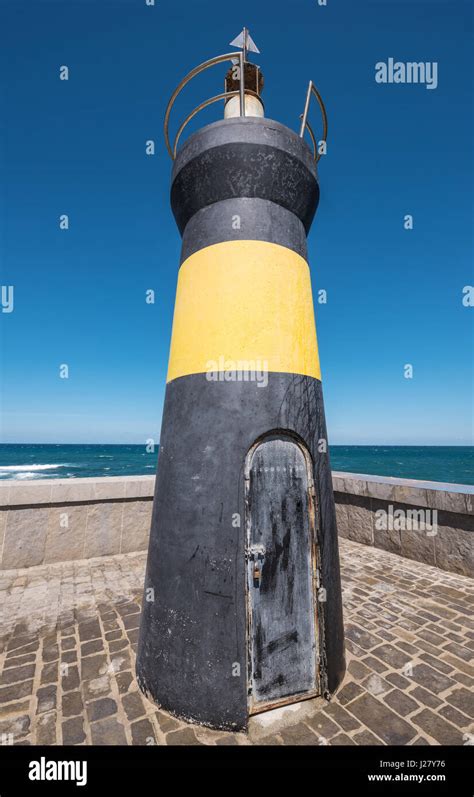 Lighthouse in Comillas port, Cantabria, Spain Stock Photo - Alamy