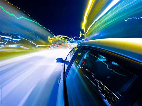 "Car Driving Fast In The Night City" by Stocksy Contributor "Studio ...