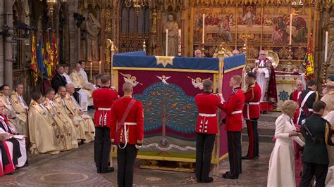 The King is anointed behind screens during coronation at Westminster ...