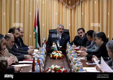 Palestinian Authority Prime Minister Ismail Haniyeh, center, from Hamas attends a meeting with ...