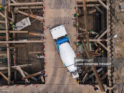 Aerial View A Cement Truck Is Pouring Cement At A Large Construction ...