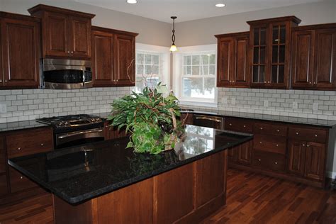 Black Pearl - Stone Source | Dark brown kitchen cabinets, Black countertops, Brown kitchen cabinets