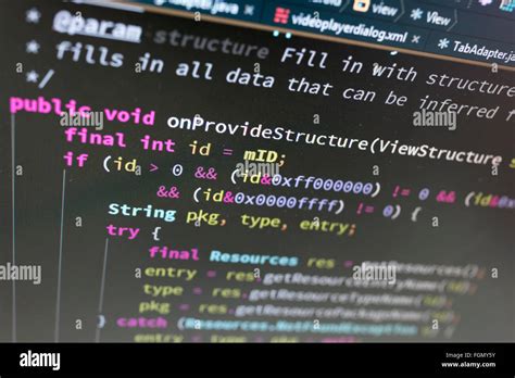 Coding on screen with colorful code Stock Photo - Alamy