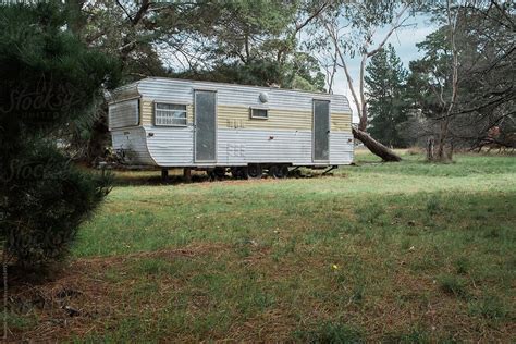 "Old Retro Caravan Parked In Bushland" by Stocksy Contributor "Rowena Naylor" - Stocksy