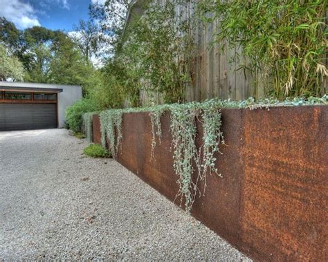 Lovely rust and hanging plants. | Garden retaining wall, Garden design, Steel retaining wall