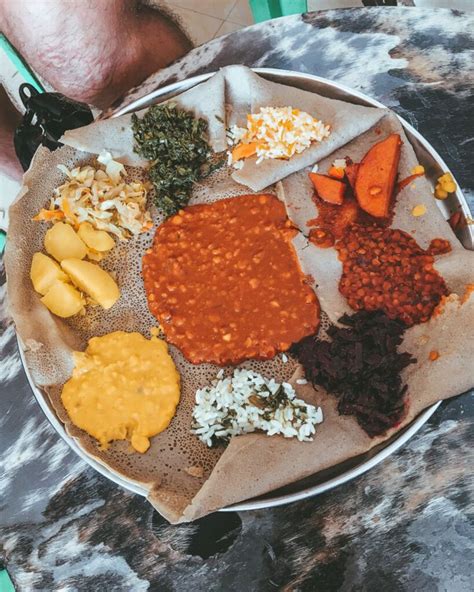 Colorful Ethiopian Breakfast: Injera and Vegetable Dishes