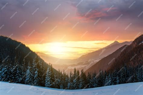 Premium Photo | Soft sunset in winter snow covered mountains with dark ...