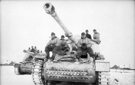 A Nashorn tank destroyer from the 519th Heavy Panzerjäger Battalion moves through snow-covered ...