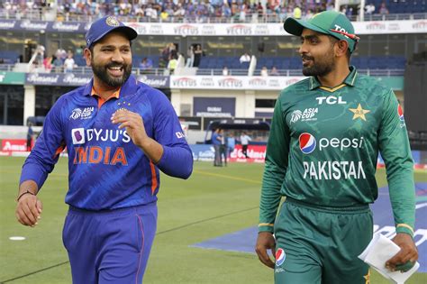 Babar Azam and Rohit Sharma walk out for the toss | ESPNcricinfo.com