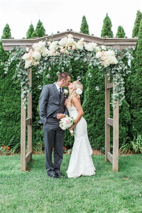 Real Weddings - Zola | Wedding arch flowers, Wedding arbors, Hydrangeas wedding