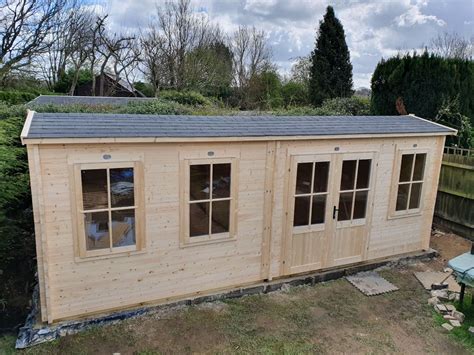 Dunster House Carsare Log cabin installation Farleigh Surrey