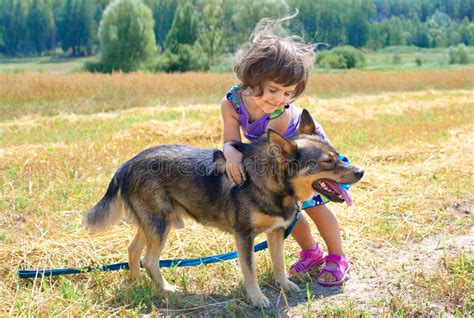 Little Girl Playing With Dog Royalty Free Stock Photos - Image: 29128298