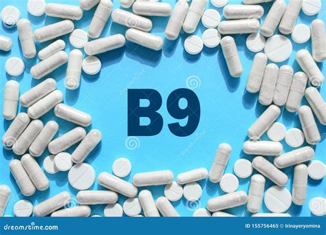 Vitamin B9 Text in White Capsules Frame on Blue Background. Pill with Folate, Folic Acid ...