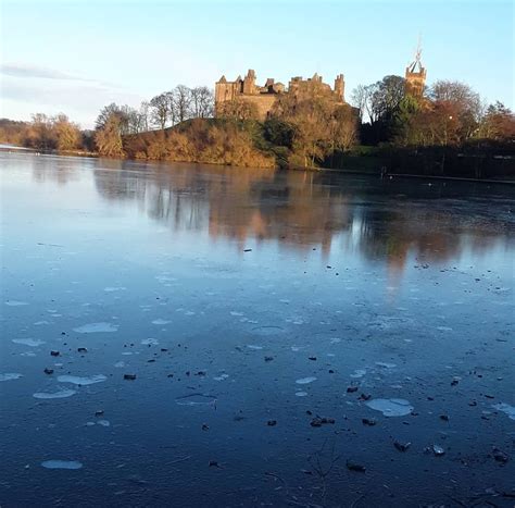 Linlithgow Loch frozen over and Linlithgow Palace on Linlithgow Peel in ...