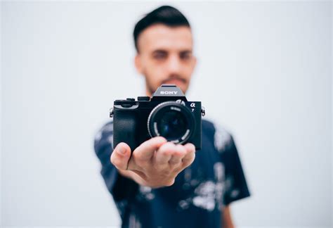 Person Holding Sony Dslr Camera · Free Stock Photo