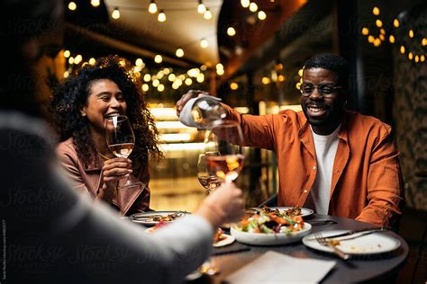 "Cheerful Diverse Friends Drinking Wine In Restaurant" by Stocksy ...