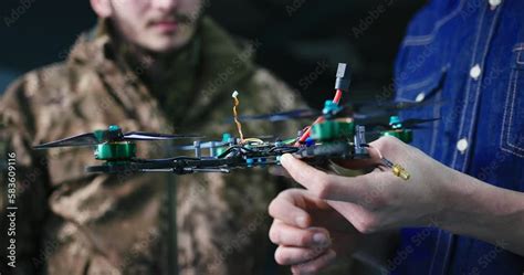 Engineer presenting new technology fpv kamikaze combat drone bomber to ...