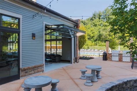 Image result for patios with garage doors | Folding garage doors, Glass garage door, Garage doors