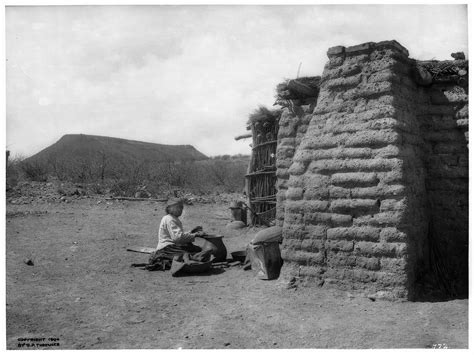 File:Pima Indian woman sitting on the ground making pottery by an adobe ...