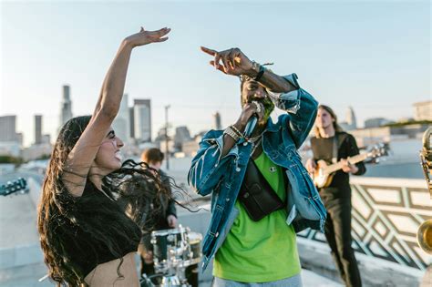 Man in Green T-shirt Raising His Hands · Free Stock Photo