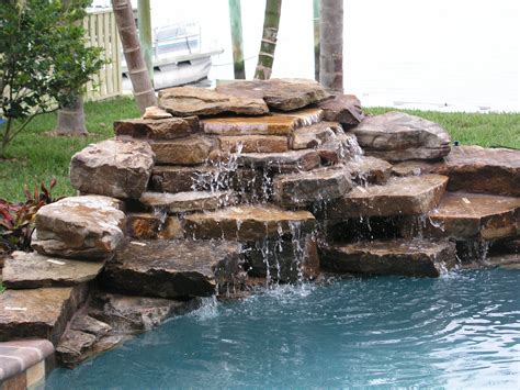 Rock Water Fountains | Waterfalls | Swimming pool waterfall, Pool ...