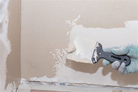 Does Mounting Putty Damage Walls? [And How To Remove It] - Home Decor Bliss