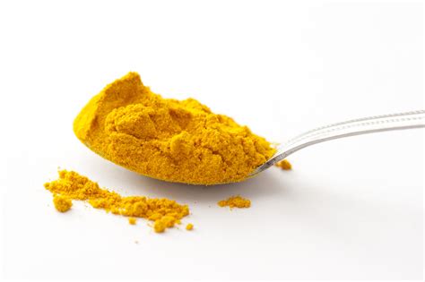 Free Stock Photo 17270 Full spoon of turmeric spice in close up | freeimageslive