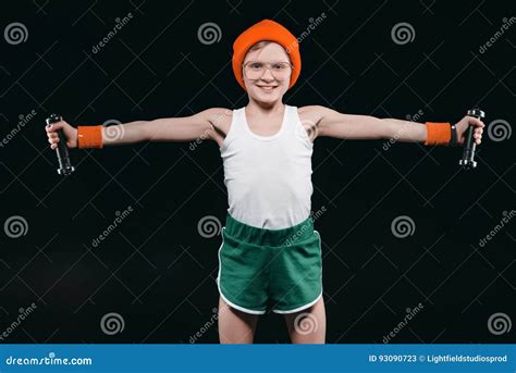 Boy Training with Dumbbells Isolated on Black Stock Image - Image of ...