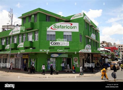 Street scene with shop painted in Safaricom old town Mombasa Island ...